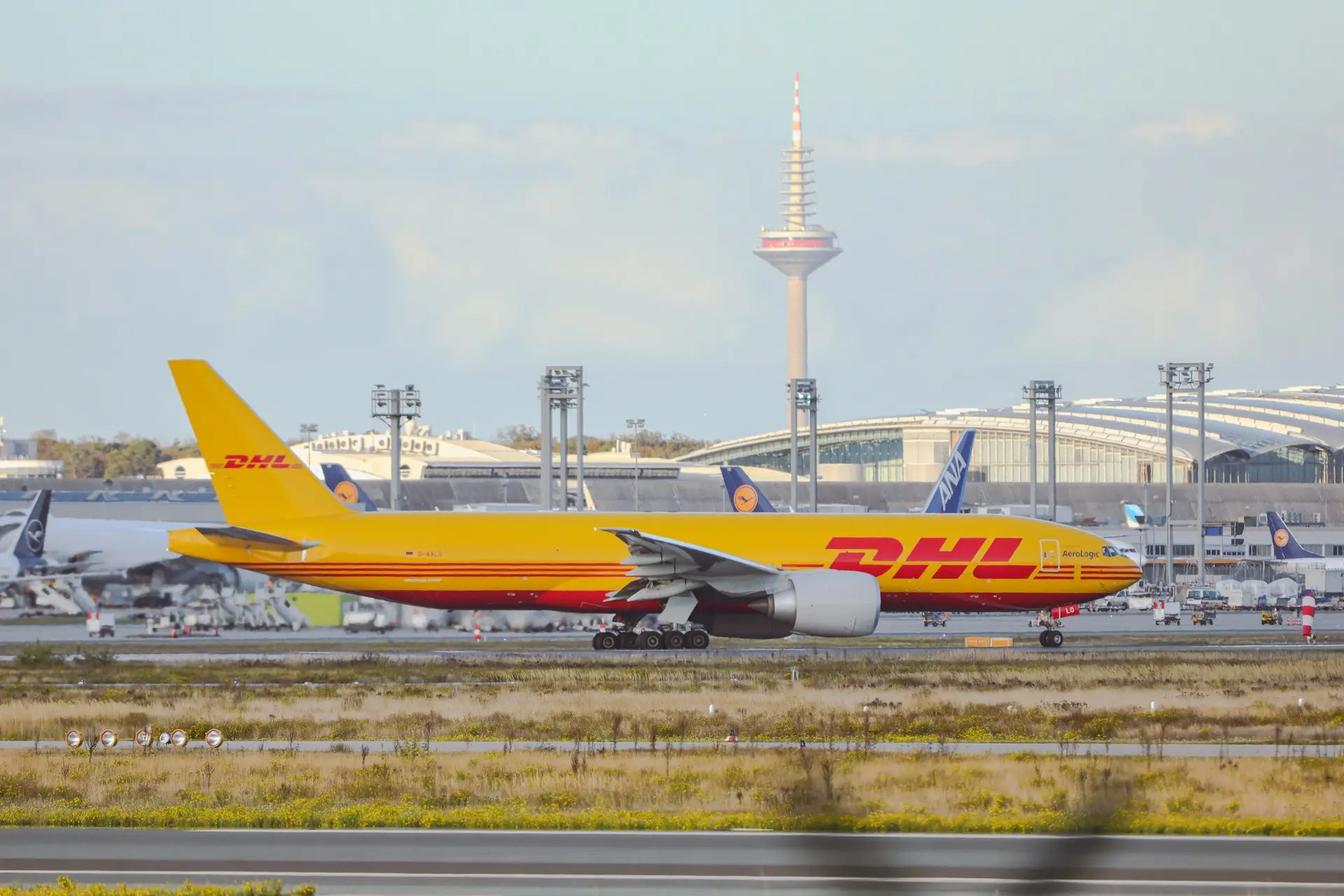 a large jetliner sitting on top of an airport runway